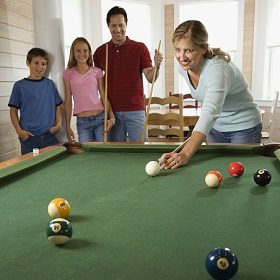 Family Playing on Pool Table