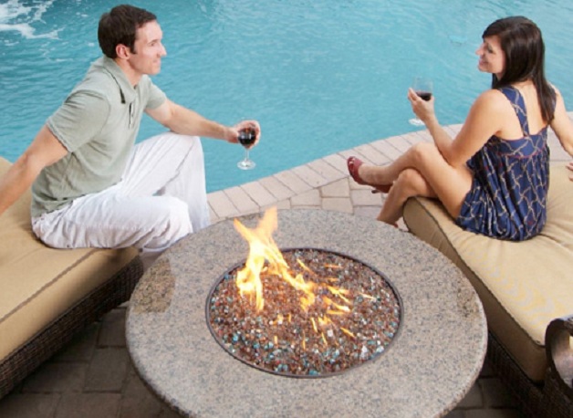 Couple Sharing Glass of Wine Next to Pool