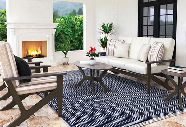 Spring patio furniture setup with spring decor and outdoor entertaining space.