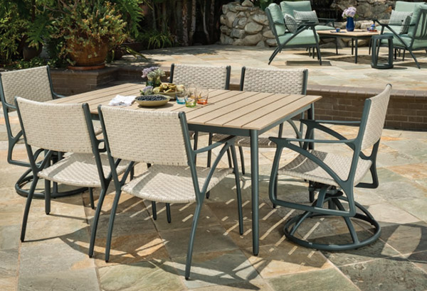 Modern outdoor patio dining set on stone patio